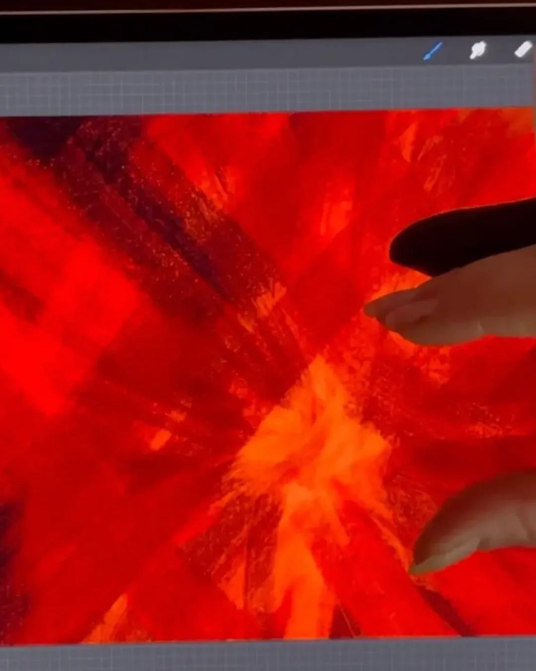 La formatrice Sylvie Roduit montre comment dessiner pour libérer ses émotions avec des traits rouges intenses exprimant la colère sur tablette.